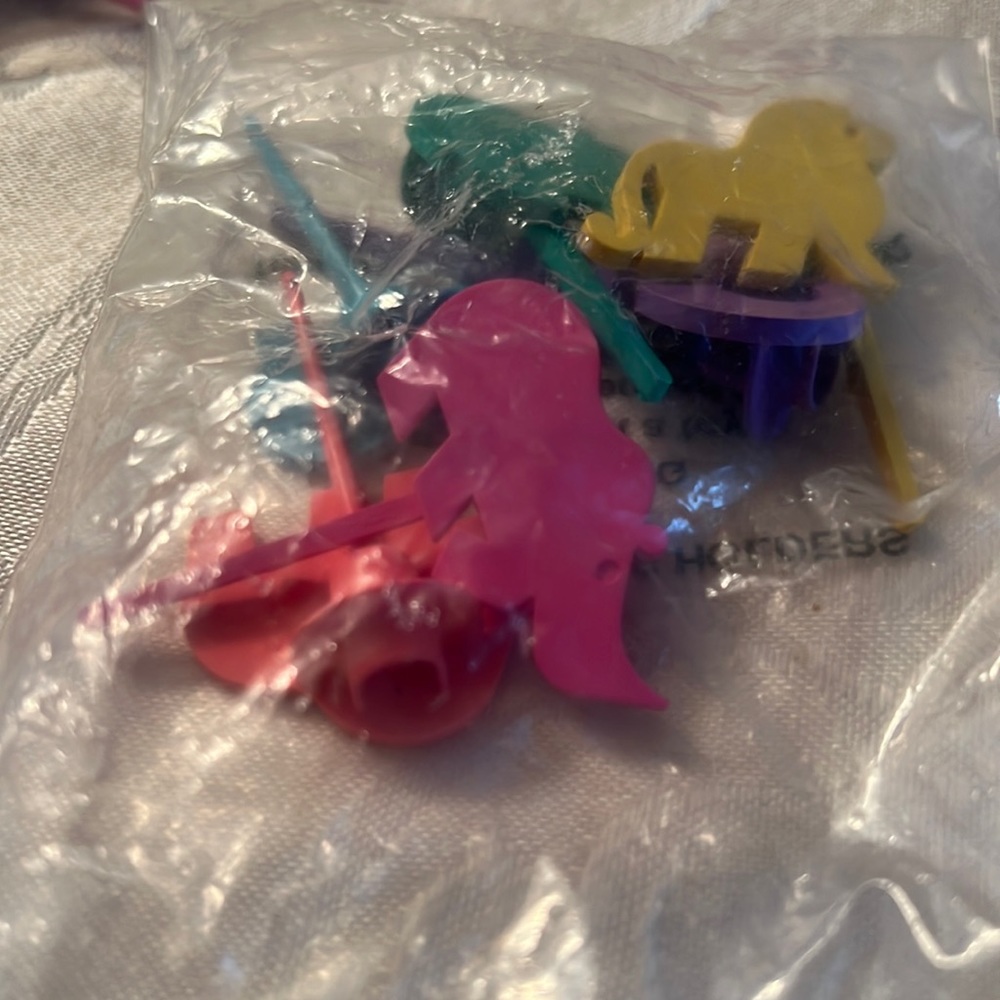 Tupperware 6 candle holders.  New in bag
